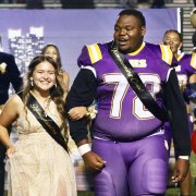 Homecoming Queen Britney Cuevas and King Isaiah Mack enjoy the spotlight at halftime of Lemoore's annual Homecoming Game.